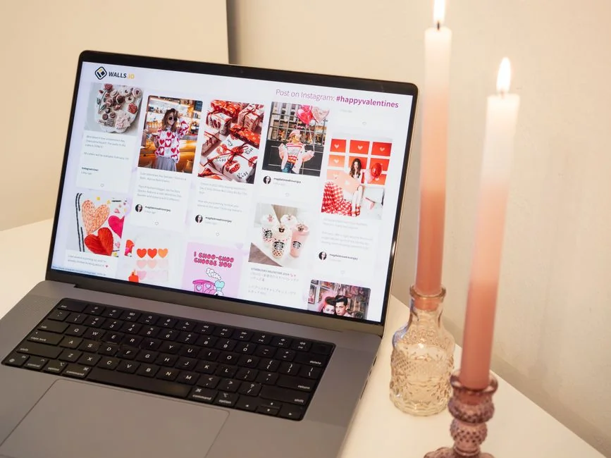 A sleek, productive workspace featuring several monitors, a laptop, and a smartphone, highlighting a web design project.